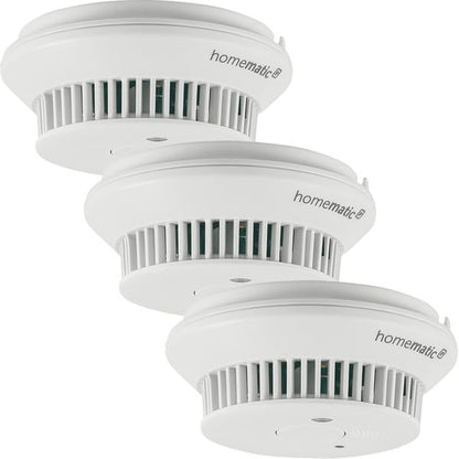 Homematic IP Smart Home Rauchwarnmelder 3er-Set Q-Label: Drei weiße, runde Melder. Erkennt Brandrauch, warnt zuverlässig vor Feuer.