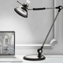 OTUS Schreibtischlampe. LED-Lampe mit retro Flexarm für dimmbare Arbeitsplatzbeleuchtung per Gestensteuerung.