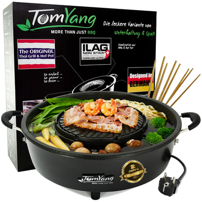 TomYang Hot Pot Thai Grill Mookata Topf - Original. Runder, schwarzer Topf mit Grillplatte und Suppenring zum Grillen und gleichzeitigen Kochen.